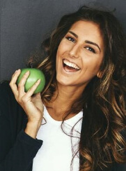 woman eating an apple, nutritional counseling