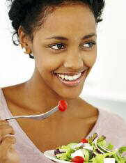 woman eating salad, nutrition counseling